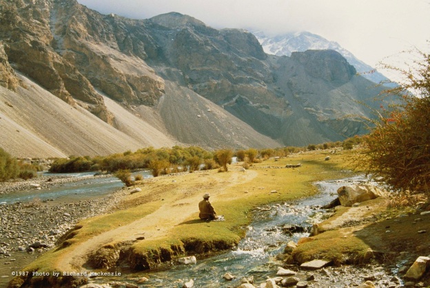 A lone mujahid stops for prayer in 1987 during a day’s march down the Kochka River in Northern Afghanistan. 