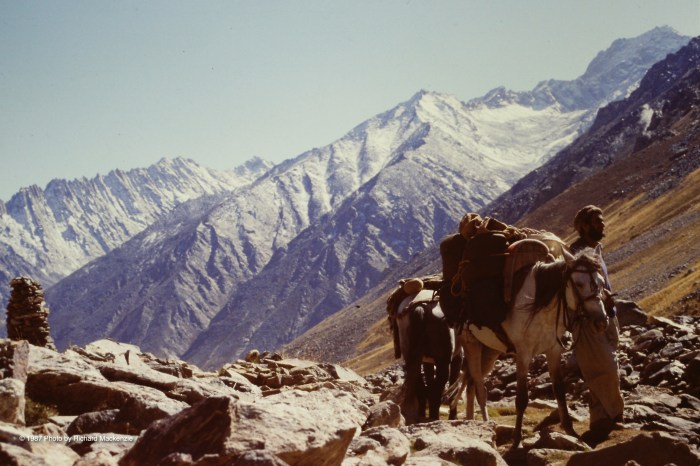 Atop one mountain pass, even Rahman Baig pauses to catch his breath.
