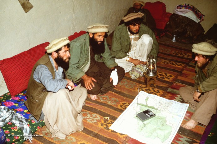 Commander Najmuddin -- with a Soviet prisoner (at right), a Stinger operator (on his left) and a key aide in his tiny guest room.